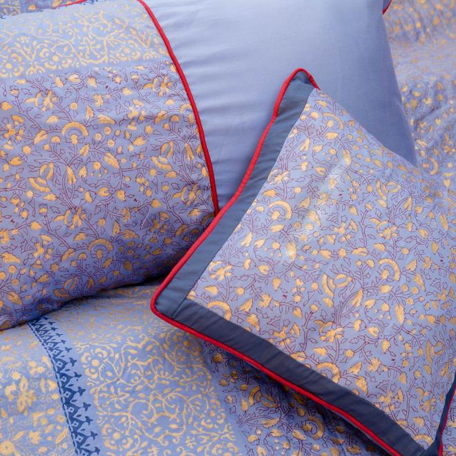 Blue block-printed duvet in shades of gold maroon and navy