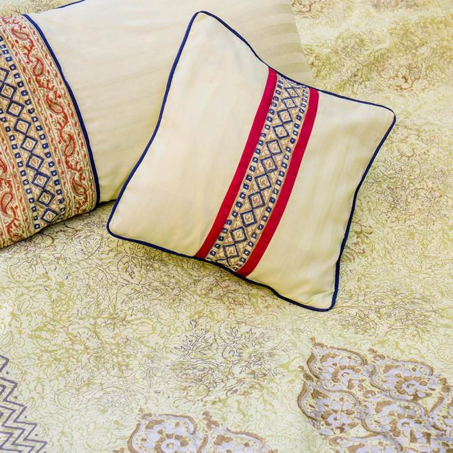 Green block printed duvet in shades of silver and gold with highlights of maroon and blue