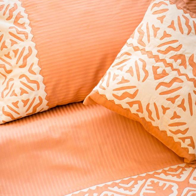 Orange quilt cover with beige rilli