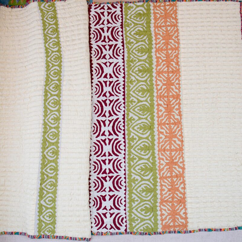 Cream Base with Rilli in Strands of Maroon, Green and Orange