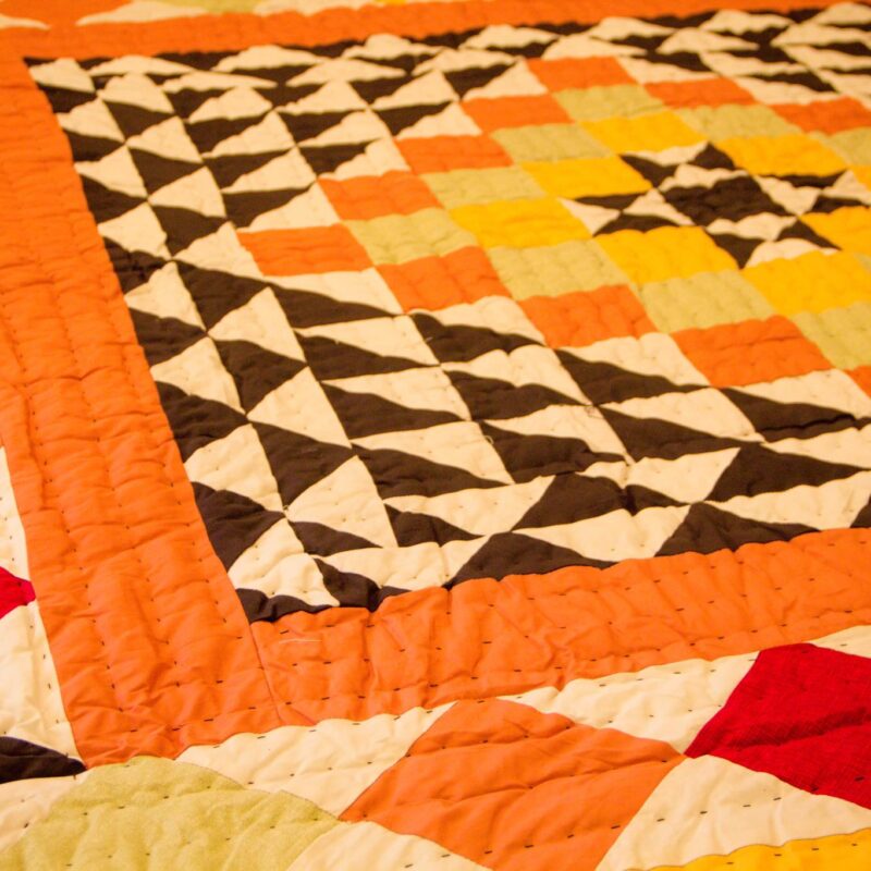 Patchwork Quilt in Orange and Black